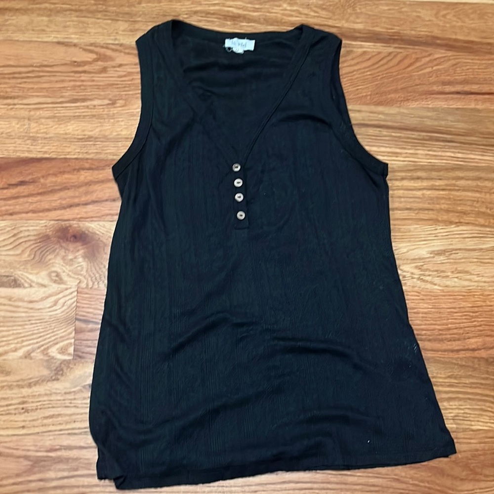 Charcoal gray tank with decorative buttons